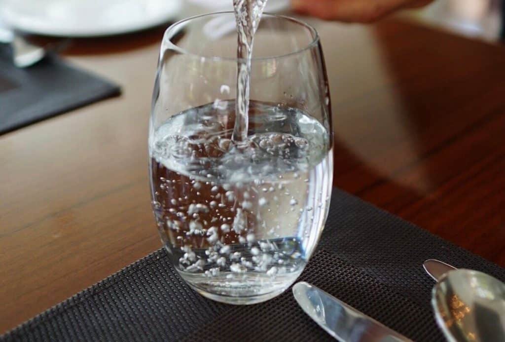 pouring water in a cup