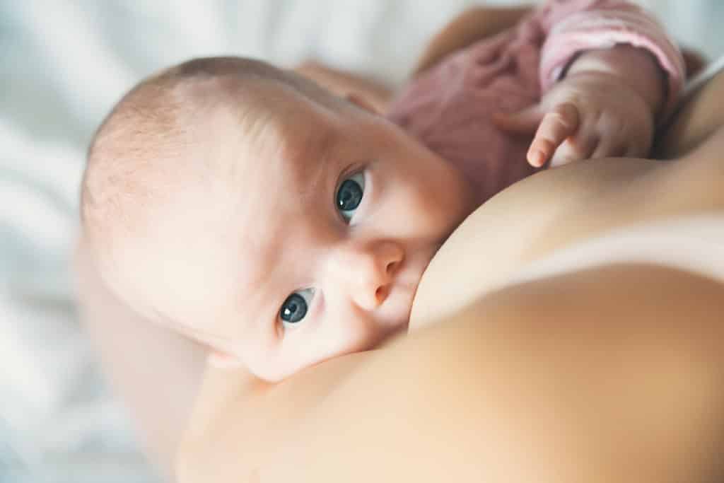 baby sucking her mum's breast